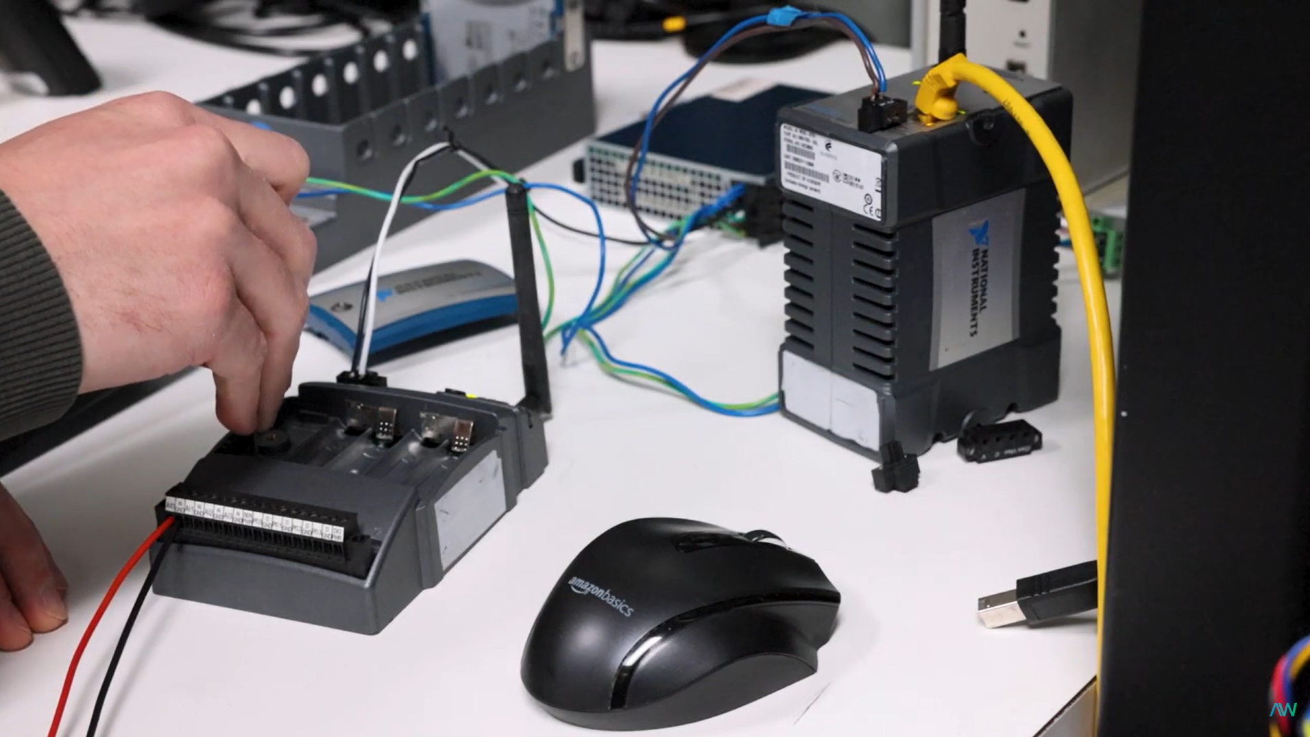 Closeup of Apex Waves technician working with obsolete NI Hardware